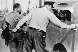 Photograph of Martin Luther King Jr. getting arrested