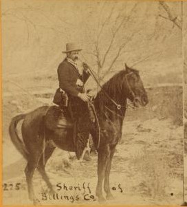 Sepia photo of a man on horseback with the caption, 